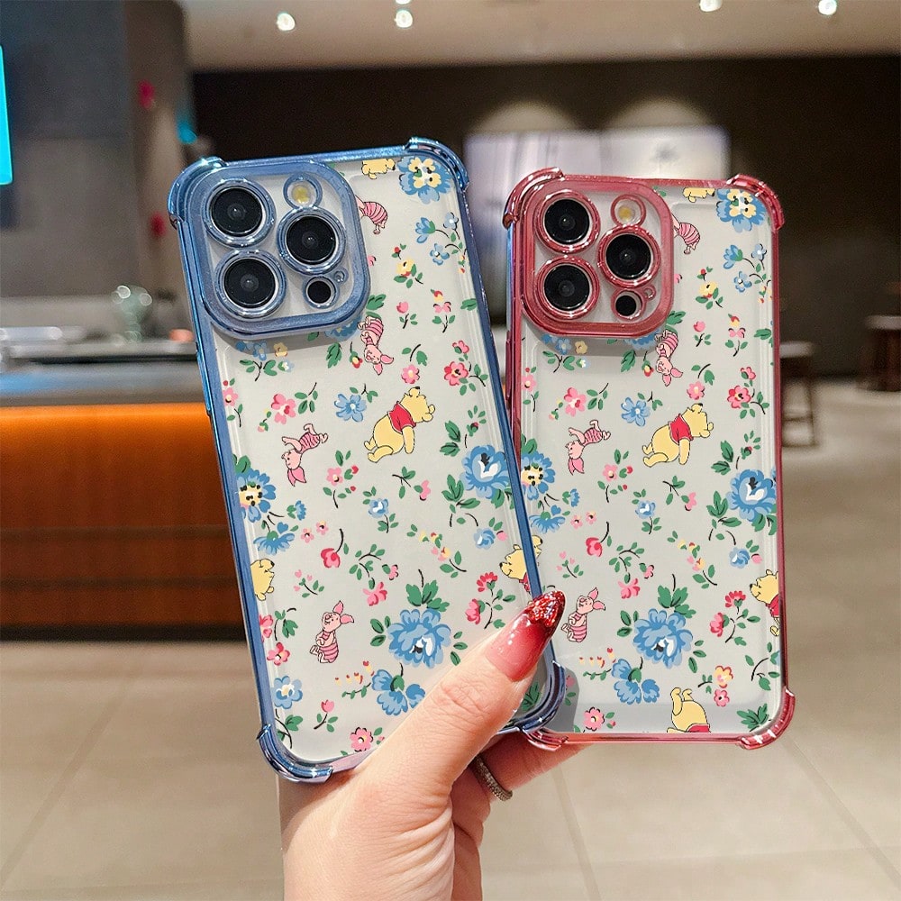 Disney.What Floral Patterned Phone Case With Winnie The Pooh Showing Friendship And Joy. Compatible With IPhone 17, 16, 15, 14, 13, 12, And 11 Pro Models. Made Of TPU With Shockproof Protection. A De
