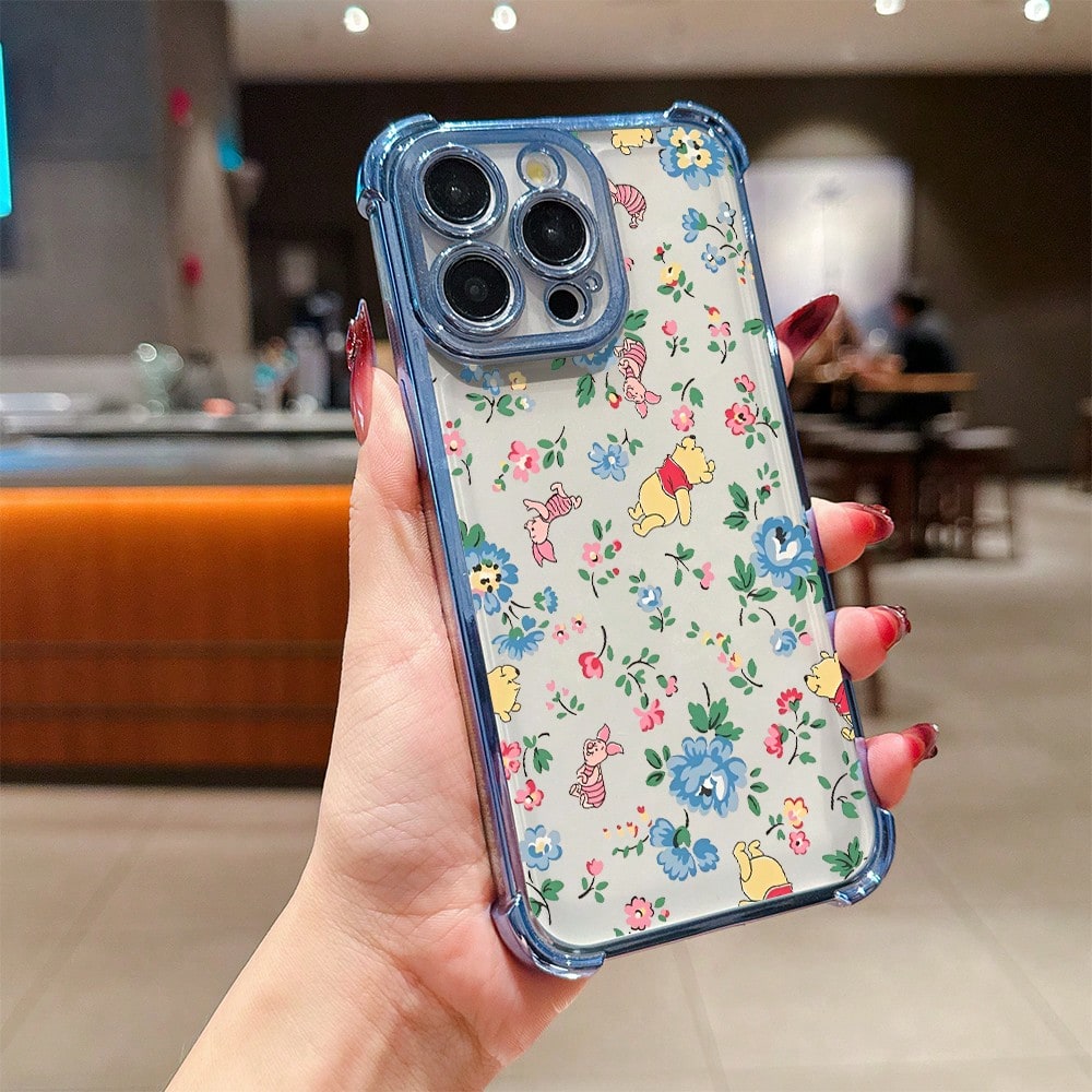 Disney.What Floral Patterned Phone Case With Winnie The Pooh Showing Friendship And Joy. Compatible With IPhone 17, 16, 15, 14, 13, 12, And 11 Pro Models. Made Of TPU With Shockproof Protection. A De