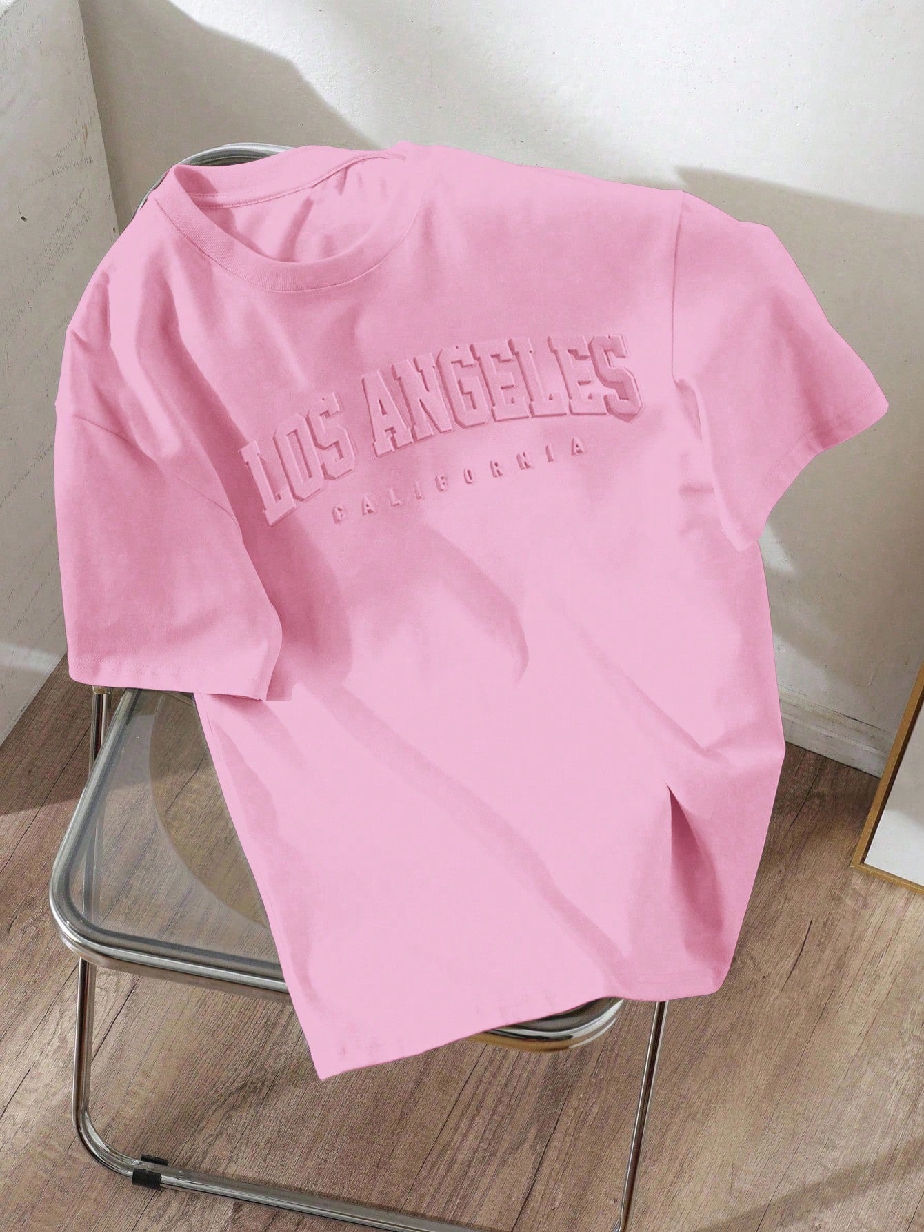 EZwear Plus Size Casual Minimalist Pink English Text Embossed Pattern Round Neck Short Sleeve Loose Fit Plus Size T-Shirt