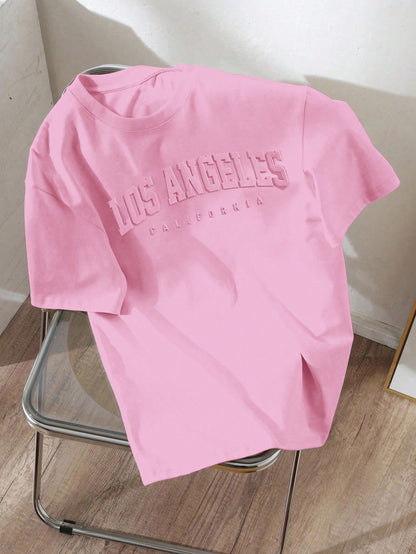 EZwear Plus Size Casual Minimalist Pink English Text Embossed Pattern Round Neck Short Sleeve Loose Fit Plus Size T-Shirt
