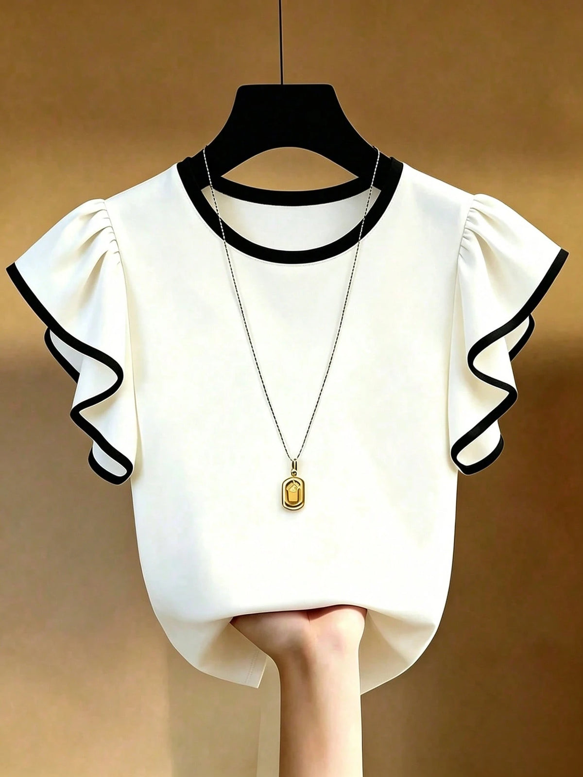 Franclia Black And White Contrast T-Shirt Made Of Skin-Friendly Elastic Fabric, Comfortable To Wear. Round Neck With Contrast Trim, Simple Yet Elegant; Flutter Sleeve Design Adds A Gentle And Yo